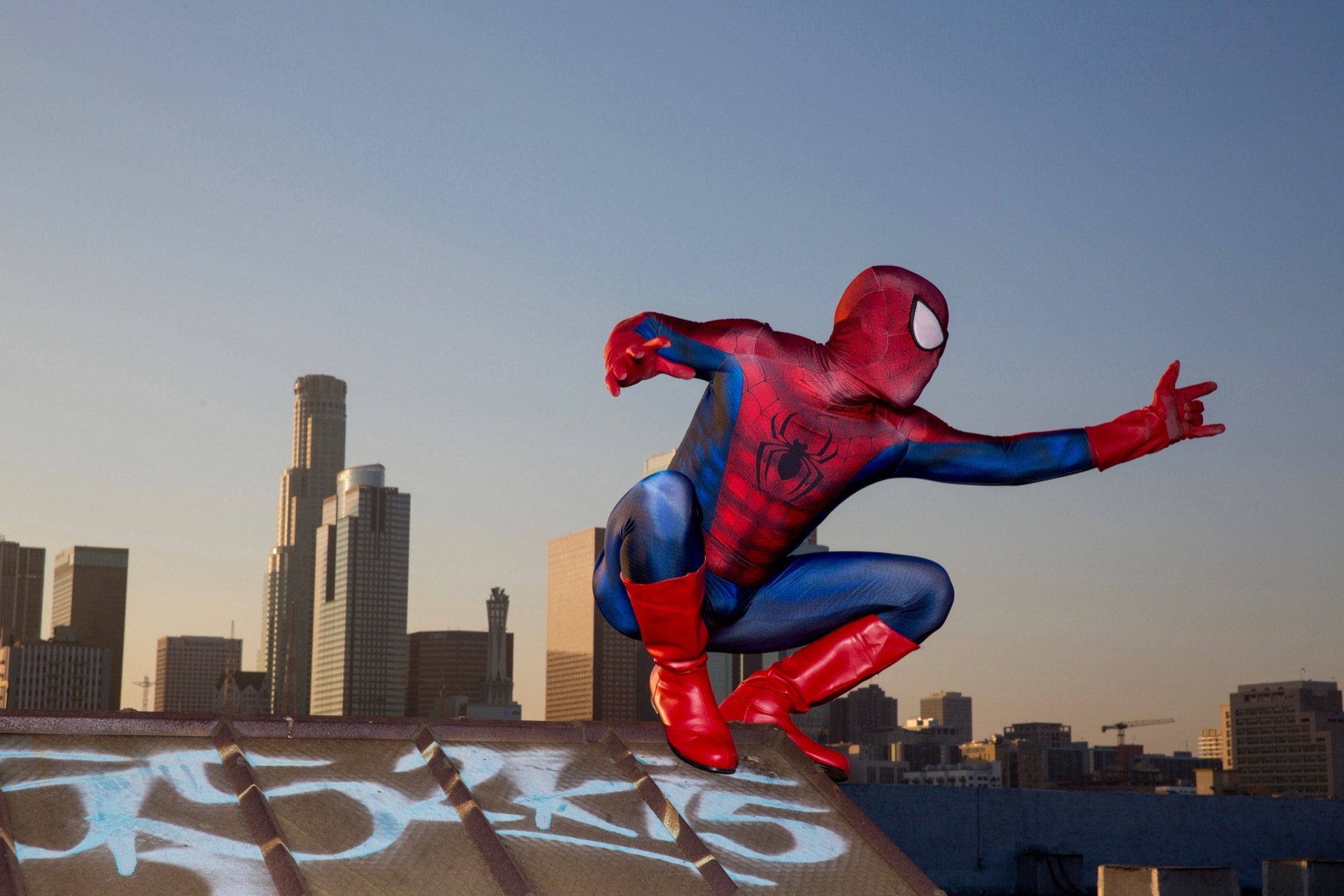 Spider-Man character bringing joy to children at a charitable event