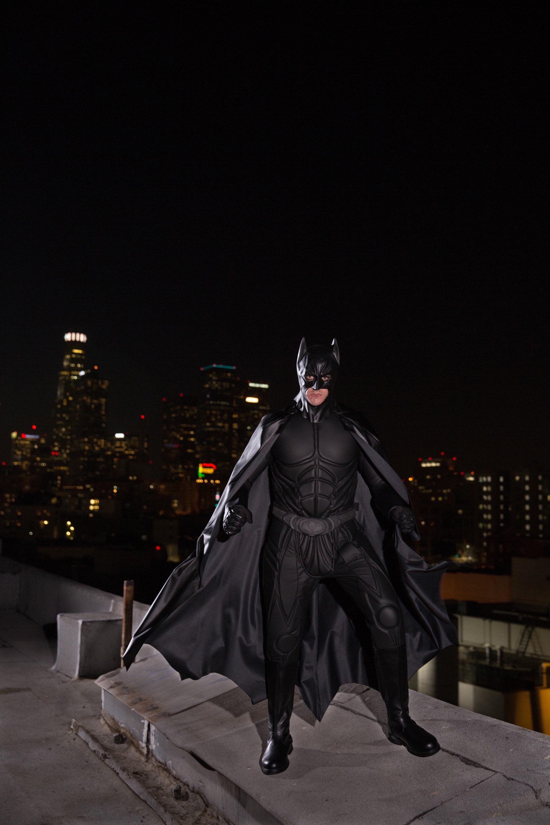 Batman superhero character at a children's birthday party with kids