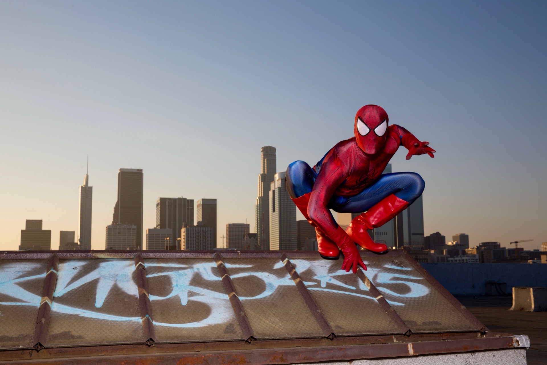 Spider-Man superhero character at a children's birthday party with kids